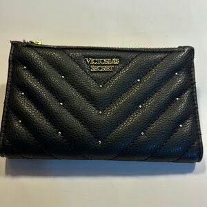 Victoria’s Secret small clutch/wallet black with gold color accents.